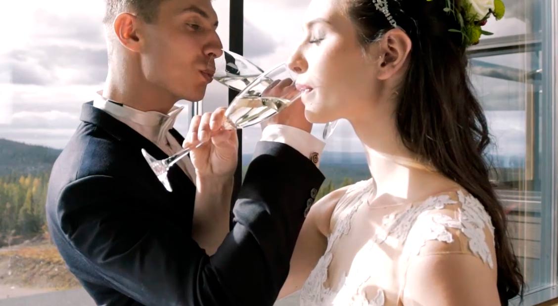 A couple having Champaign on their wedding day.